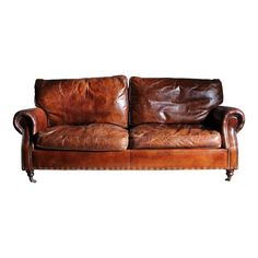 a brown leather couch sitting on top of a white background