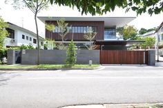 a modern house is shown from the street