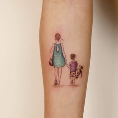 a woman and child tattoo on the arm