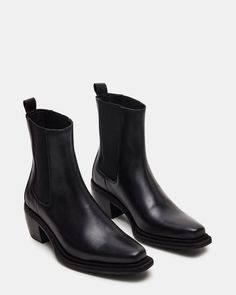 Step out in style with our METRO bootie. Featuring a sleek square toe and chic ankle boot design, this everyday chelsea boot is the epitome of sophistication. Crafted with a gore stretch for added comfort, it's the perfect combination of fashion and function. 2.25 inch heel height 9.5 inch shaft circumference 6 inch sh Modern Chelsea Boots With High Ankle, Modern Chelsea Boots For Winter Workwear, Trendy Chelsea Boots With Reinforced Heel For Fall, Classic Chelsea Boots With Sculpted Heel For Fall, Trendy Chelsea Boots With Reinforced Heel For Work, Square Toe Chelsea Boots With Reinforced Heel For Work, Modern Chelsea Boots With Stacked Heel And Square Toe, Chelsea Boots With Heel Pull Tab, Medium Width, Square Toe Chelsea Boots For Workwear