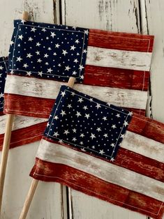 two american flags made out of wood sticks