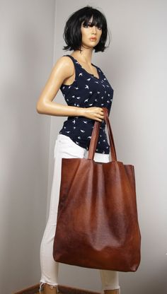 Very Large Women Bag, Brown Leather Tote Bag, Cognac Brown Oversized tote bag.Dimension details:Max width at the top: 51 cm /20"Height: 53 cm /21"Depth:11,5 cm / 4,5"Handle drop: 25,5 cm / 10"Very large, high bag made of soft cowhide.The oversize  tall bag has a simple design and practical character that will make it very practical in many situations. Bag without lining with two large pockets.******************************************************Add this gorgeous bag to your collection!!To retur Large Brown Leather Shoulder Bag, Brown Leather Tote Bag, Large Leather Bag, Everyday Tote Bag, Everyday Handbag, Large Leather Tote Bag, Large Handbag, Oversized Tote Bag, Oversized Tote