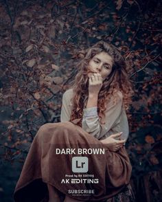 a woman sitting on top of a tree stump with her hand under her chin and the words dark brown above her head