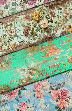 an old wooden plank with flowers painted on the side and green, blue, pink, yellow