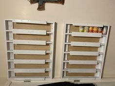 there are two empty shelves on the wall next to each other with food in them