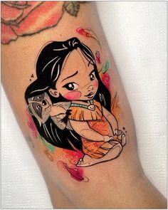 a woman's leg with tattoos on it and an orange rose in the background