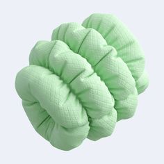 an image of a green object that looks like it is made out of fabric and yarn