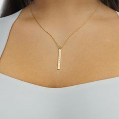 The vertical bar necklace with engraving is a fresh take on the name bar pendant. The vertical pendant design, which can be personalized with the word or name of your choice, will stand out against your other jewelry. Perfect for layering, it can be dressed up or down. Gold Bar Necklace Personalized, Horizontal Bar Necklace, Arabic Jewelry, Vertical Bar Necklace, Bar Necklace Personalized, Formal Accessories, Everyday Bracelet, Vertical Bar, Turquoise Bead Necklaces