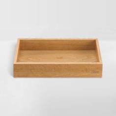 an empty wooden tray on a white background