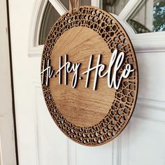 "Bring a touch of love and warmth to your front door with this beautiful Heartwarming Wooden Welcome Door Sign. Made from high-quality wood, this door hanger features a charming heart design that's sure to make a statement. Its natural grain and sturdy construction make it weather-resistant, so you can hang it with confidence, knowing it will look great for years to come. Personalize it with your family name or house number for an extra special touch. This door sign is the perfect way to greet guests and show them they're always welcome in your home. ♡ DETAILS: 14\" oval made of high-quality 1/4\" thick birch wood with a 3-DIMENSIONAL 1/4\" birch cut out.  It comes with a burlap hanger for ease of hanging on a door or wall." Rustic Wooden Door Sign, Home Signs Outdoor, Funky Front Door Decor, Door Hangers Wood, Welcome Home Door Sign, Home Door Sign, Welcome Door Sign, Welcome Home Signs, Laser Cut Wood Crafts