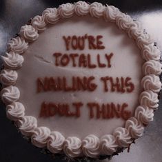 a cake with writing on it that says, you're totally nailing this about thing