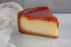 a piece of cheesecake with ketchup on top