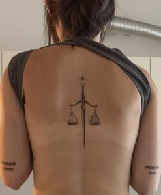 Back Tattoo Women Symmetrical, Tattoos That Represent Independence, Dagger Back Tattoo, Dagger Spine Tattoo, Memento Vivere Tattoo, Dagger Tattoos, Tattoos Spine, Scale Tattoo, Spine Tattoos For Women