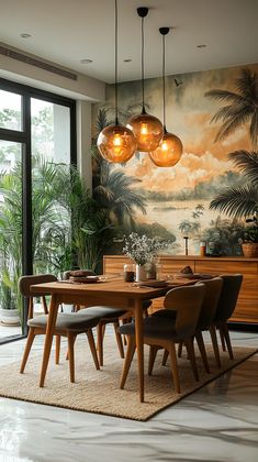 a dining room table with chairs and lights hanging from it's ceiling, in front of a palm tree mural