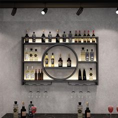 a bar with wine glasses and liquor bottles on it's shelves, all lined up against the wall