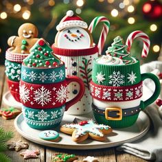 christmas tea cups and gingerbreads on a plate