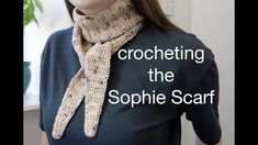 a woman wearing a scarf with the words crocheting the sophiie scarf