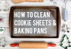 a baking pan with cookie sheets and rolling pins on it, surrounded by kitchen utensils