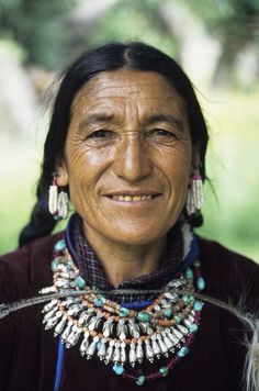 an old native woman with beads and necklaces