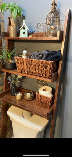 a bathroom shelf filled with baskets and toilet paper