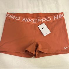 an orange nike shorts with the words pro mike pro nik printed on it's side