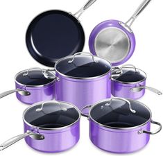 purple pots and pans are stacked on top of each other