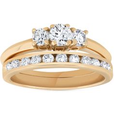 two gold wedding rings with diamonds on each one and an engagement ring in the middle