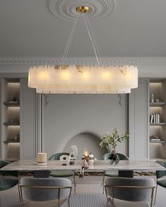 an elegant dining room with marble table and chairs