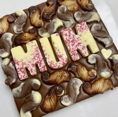 the word hunk spelled out in chocolate and nuts