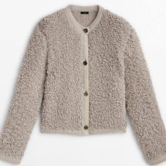 a women's cardigan sweater with buttons on the front and sleeves in beige