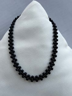 Beautiful and elegant black beaded choker necklace  Necklace length is 16 inches long  With adjustable chain Elegant Black Round Bead Crystal Necklaces, Elegant Black Single Strand Crystal Necklace, Elegant Adjustable Black Crystal Necklace, Elegant Polished Black Beads, Elegant Black Polished Beads, Elegant Black Beaded Necklace With Tiny Beads, Elegant Beaded Choker Necklace, Minimalist Black Beaded Choker Necklace, Formal Beaded Pearl Choker Necklace