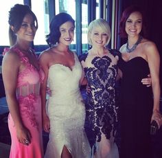 four women in evening gowns posing for the camera with one woman wearing a dress