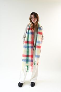 The Leah Scarf is our oversized, ultra soft blanket scarf with a multicolored plaid pattern and loose fringe ends. Designed for layering and ideal for cold weather, wrap the Leah Scarf around once or twice for a luxe, blanketed look. Oversized scarf Multicolored plaid pattern Hues of red, yellow, green, and blue Loose twisted fringe ends Soft, polyester fleece blend 11.6 inches x 90.5 inches Accessories are final sale. Your order will ship from our warehouse in FL, USA. Bright Check Scarf, Soho Ny, Rachel Parcell, Top Sunglasses, Oversized Blanket, Stars Then And Now, Oversized Scarf, Blanket Scarf, Soft Blankets