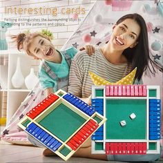 an adult and child playing with magnetic tiles in front of a poster that says interesting cards