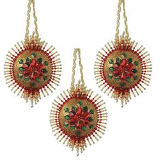 two red and green beaded ornaments hanging from strings on a white background with clippings