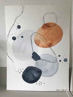 an abstract painting on white paper with black and orange circles