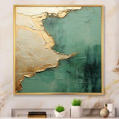 an abstract painting in gold and green on a white wall above a fireplace mantel