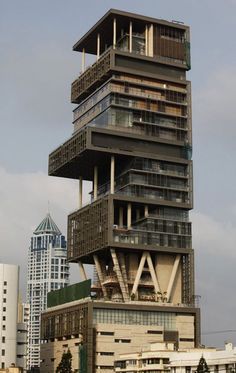 a tall building with balconies on the top