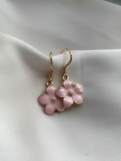 These stunning pink flower earrings are perfect for a friend, yourself or gift for Mother's Day! - Handmade by me  - Hypoallergenic gold plated 304 stainless steel hooks - All earrings come with a rubber back. - Your purchase will come in a card holder, bag, and a bag of sweets 🍬  - For hygiene reasons NO RETURNS OR     REFUNDS. - FREE SHIPPING Care info:  Please take care of your handmade earrings. Do not sleep in them, come into contact with water with them or perfume etc as this will damage Cheap Spring Flower Charm Earrings, Summer Jewelry With 3d Flower Shapes, Spring Flower Shaped Jewelry With 3d Flowers, Feminine Flower-shaped Earrings For Gifts, Delicate Flower Earrings For Spring, Feminine Blossom Jewelry For Spring, Delicate Flower Charm Earrings For Spring, Gold Flower Charm Earrings For Summer, Delicate Flower Shaped Earrings For Spring