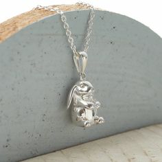 PRODUCT DESCRIPTION * Adorable and beautifully detailed solid sterling silver rabbit necklace. * Add a personalised tag to the clasp of the necklace to create a perfect bespoke gift. PERSONALISATION * We engrave our pieces to create bespoke items especially for you, we are always happy to try and help if something is unsuitable but we regret we are unable to offer refunds on personalised items. FREE GIFT BOX * This necklace comes beautifully packaged in our Hurleyburley gift box tied with a silk Jackrabbits Necklace, Silver Bunny Design Jewelry For Gifts, Silver Bunny Design Jewelry Gift, Silver Jewelry With Bunny Design For Gift, Lop Eared Rabbit, Rabbit Necklace, Bunny Jewelry, Rabbit Jewelry, Velveteen Rabbit