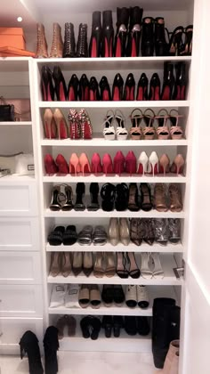 a closet filled with lots of different types of shoes