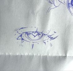 an eye drawn on top of a piece of paper