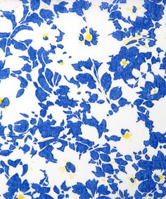 a blue and white floral print fabric with yellow flowers on the bottom half of it