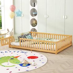 a baby's room with a wooden crib and toys on the floor in front of it