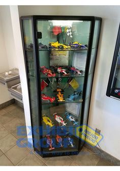 a display case filled with lots of toy cars