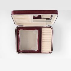 an open red and white case with two compartments