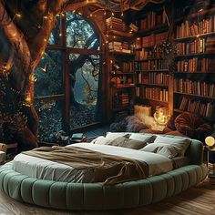 a large bed sitting under a window next to a bookshelf filled with lots of books