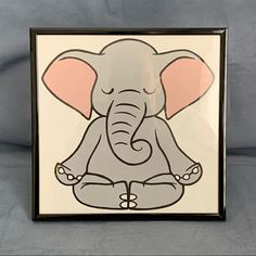 an elephant sitting in the middle of a frame