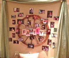 a bed with pictures on the wall above it and a wheel hanging from the headboard