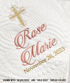 a close up of a cross on top of a table cloth with the words, rose marie november 26, 2013